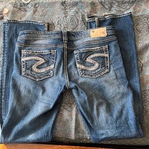 Silver jeans.  Good condition, minimal fraying on back hem.